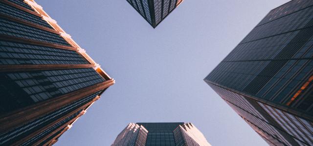 low-angle photography of four high-rise buildings by Kevin Matos courtesy of Unsplash.